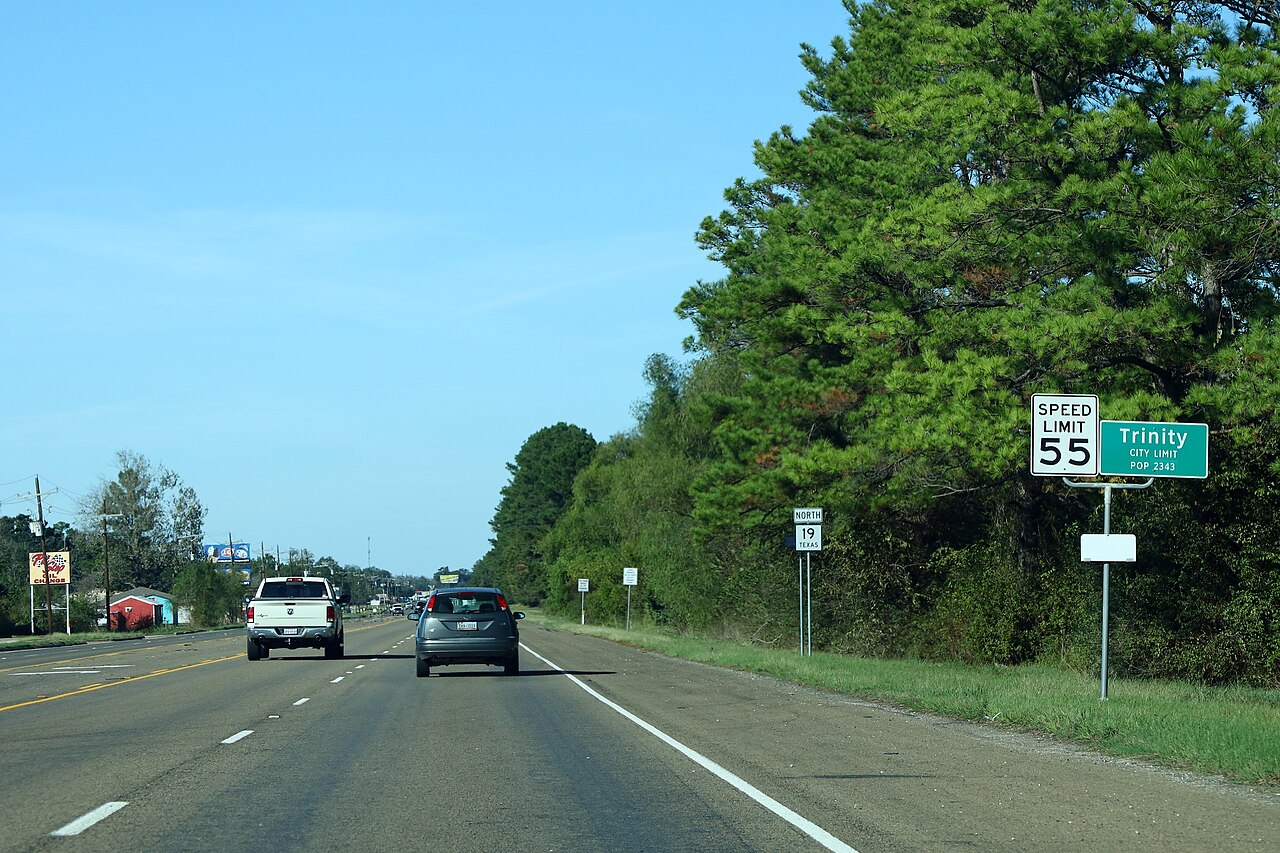 The TX-19 city limit sign coming into Trinity.